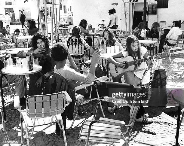 Spain, Balearic Islands, Ibiza, hippies in a pavement cafe, 1972