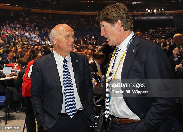 General manager Lou Lamoriello speaks to head coach Mike Babcock of the Toronto Maple Leafs during round one of the 2016 NHL Draft at First Niagara...