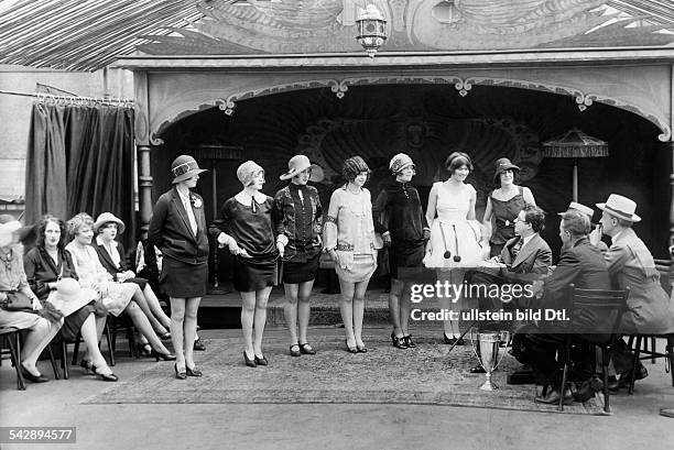 Beauty contests Female participants of the beauty contest 'America's most beautiful leg' are lifting their skirts and showing their legs in front of...