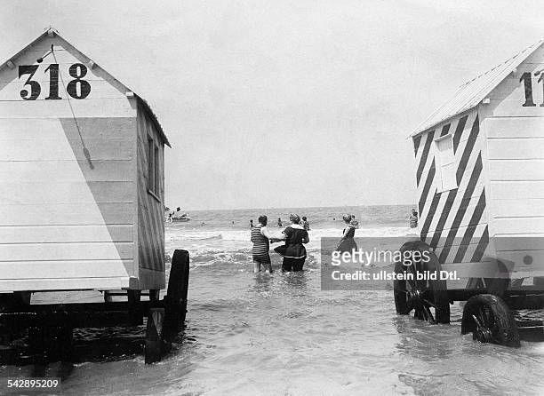 Belgium, Flanders, Ostende: two bathing machines at the beach, date unknown, probably around 1904