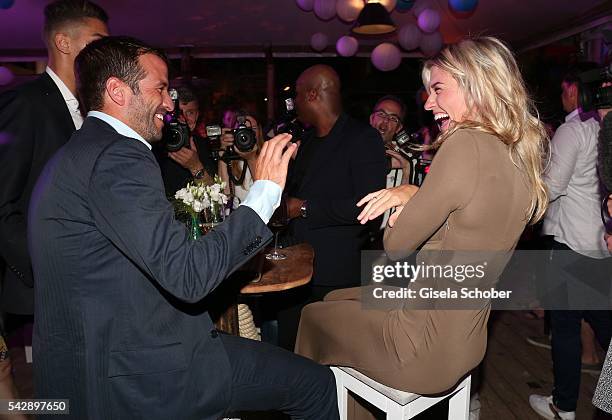 Rafael van der Vaart and his girlfriend Estavana Polman jokes during the Raffaello Summer Day 2016 to celebrate the 26th anniversary of Raffaello on...