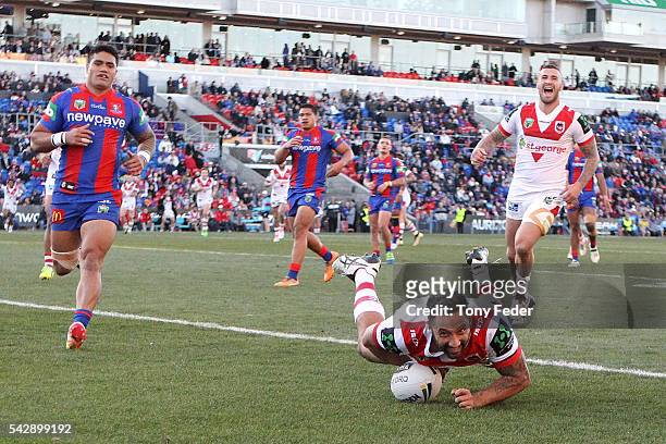 Benji Marshall of the Dragons scores a try during the round 16 NRL match between the Newcastle Knights and the St George Illawarra Dragons at Hunter...