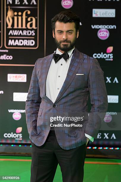 Indian Bollywood actor Fawad Khan poses on the green carpet as she arrives to the 17th edition of IIFA Awards in Madrid on June 24, 2016.