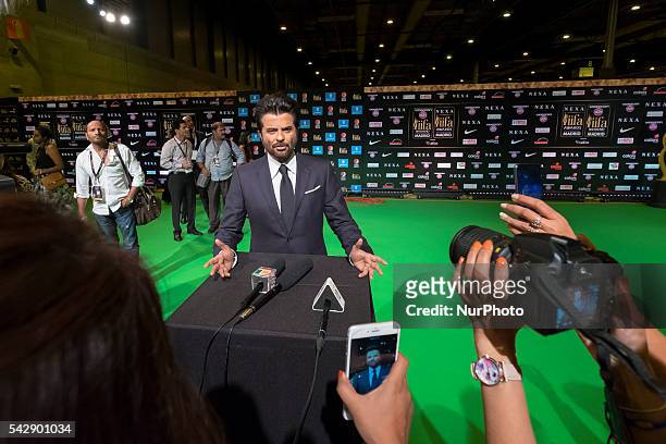 Indian Bollywood Anil Kapoor poses on the green carpet as she arrives to the 17th edition of IIFA Awards in Madrid on June 24, 2016.