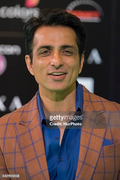 Indian Bollywood actor Sonu Sood poses on the green carpet as she arrives to the 17th edition of IIFA Awards in Madrid on June 24, 2016.