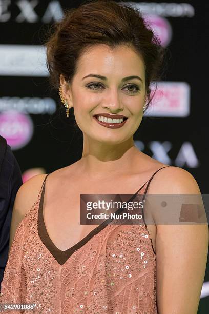 Indian Bollywood actress Dia Mirza poses on the green carpet as she arrives to the 17th edition of IIFA Awards in Madrid on June 24, 2016.