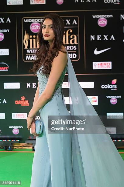 Indian Bollywood actress Athisa Shetty poses on the green carpet as she arrives to the 17th edition of IIFA Awards in Madrid on June 24, 2016.
