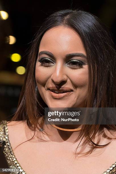 Indian Bollywood actress Sonakshi Sinha poses on the green carpet as she arrives to the 17th edition of IIFA Awards in Madrid on June 24, 2016.