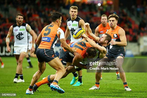Matthew Wright of Carlton is tackled during the round 14 AFL match between the Greater Western Sydney Giants and the Carlton Blues at Spotless...