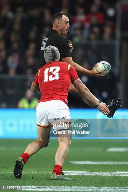Israel Dagg of the All Blacks is tackled by Jonathan Davies of Wales during the International Test match between the New Zealand All Blacks and Wales...
