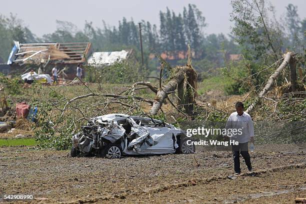 June 24£¬ The villagers after the destruction of the car in Danping Village of Chenliang Township in Funing, Yancheng, east China's Jiangsu Province,...