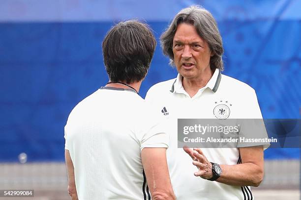 Joachim Loew head coach of Germany talks to team doctor Hans-Wilhelm Mueller-Wohlfahrt during a Germany training session ahead of their Euro 2016...