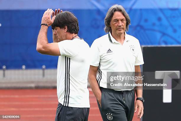 Joachim Loew head coach of Germany talks to team doctor Hans-Wilhelm Mueller-Wohlfahrt during a Germany training session ahead of their Euro 2016...