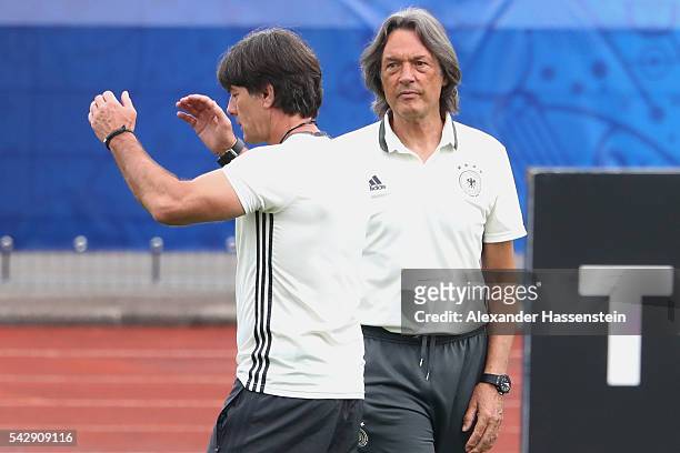 Joachim Loew head coach of Germany talks to team doctor Hans-Wilhelm Mueller-Wohlfahrt during a Germany training session ahead of their Euro 2016...