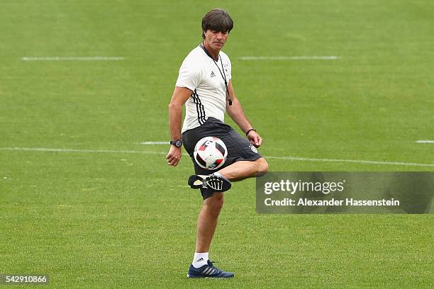 Joachim Loew, head coach of Germany plays with the ball during a Germany training session ahead of their Euro 2016 round of 16 match against Slovakia...