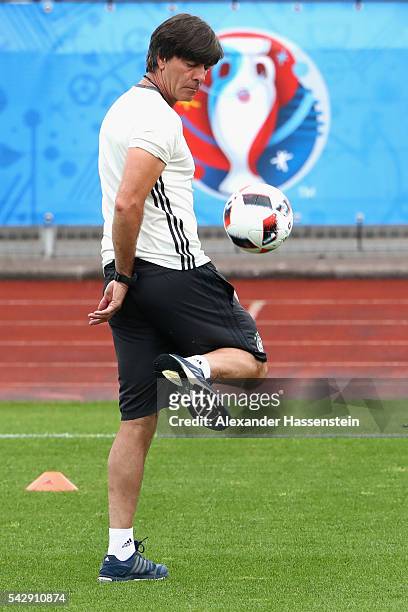 Joachim Loew, head coach of Germany plays with the ball during a Germany training session ahead of their Euro 2016 round of 16 match against Slovakia...