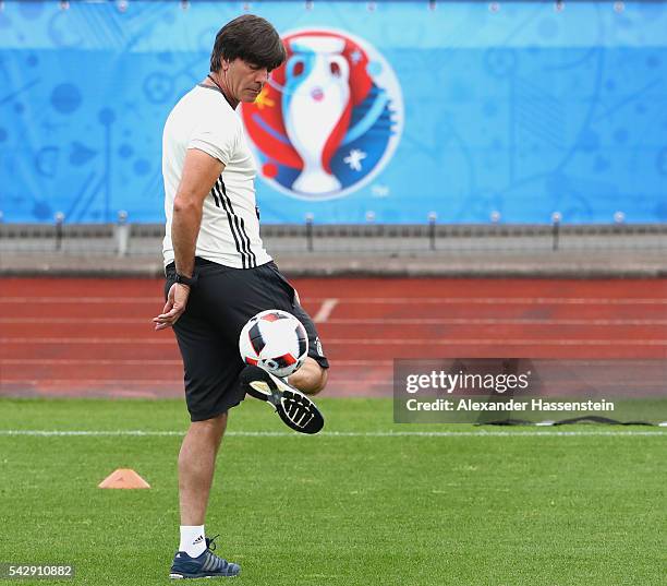 Joachim Loew, head coach of Germany plays with the ball during a Germany training session ahead of their Euro 2016 round of 16 match against Slovakia...