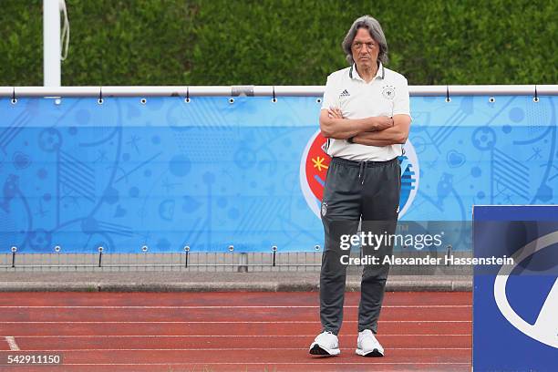 Hans-Wilhelm Mueller-Wohlfahrt team doctor of team Germany looks on during a Germany training session ahead of their Euro 2016 round of 16 match...