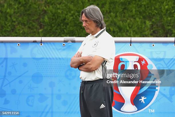 Hans-Wilhelm Mueller-Wohlfahrt team doctor of team Germany looks on during a Germany training session ahead of their Euro 2016 round of 16 match...