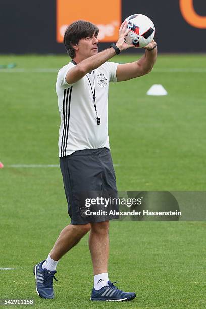 Joachim Loew, head coach of Germany plays with the ball during a Germany training session ahead of their Euro 2016 round of 16 match against Slovakia...