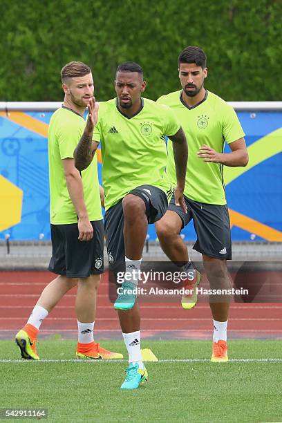 Jerome Boateng of Germany warms up for a Germany training session ahead of their Euro 2016 round of 16 match against Slovakia at Ermitage Evian on...