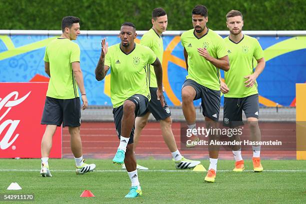 Jerome Boateng of Germany warms up for a Germany training session ahead of their Euro 2016 round of 16 match against Slovakia at Ermitage Evian on...