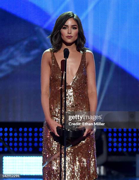 Miss Universe 2012 Olivia Culpo presents the Lady Byng Memorial Trophy during the 2016 NHL Awards at The Joint inside the Hard Rock Hotel & Casino on...