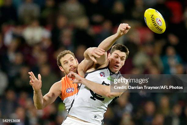 An umpire practices his centre bounce technique before the round 14 AFL match between the Greater Western Sydney Giants and the Carlton Blues at...