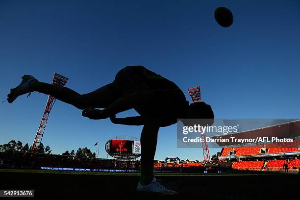 An umpire bounces a ball before the round 14 AFL match between the Greater Western Sydney Giants and the Carlton Blues at Spotless Stadium on June...