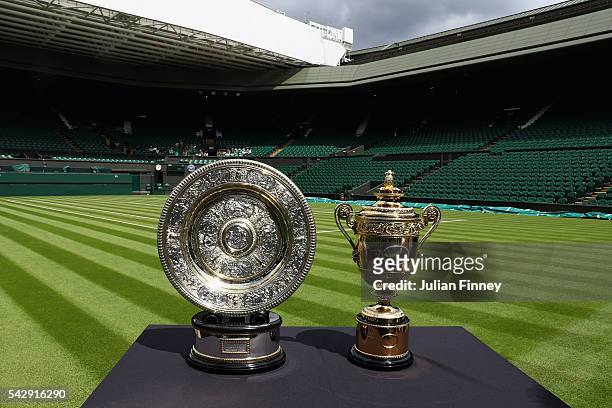 The Gentlemen's and Ladies' trophies are displayed on Centre Court during previews for Wimbledon Tennis 2016 at Wimbledon on June 25, 2016 in London,...