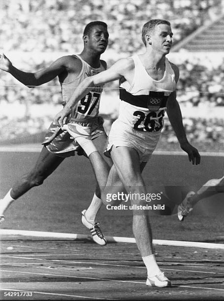 Armin Hary winning the Olympic 100 metres in Rome 1960; behind him is Dennis Johnson
