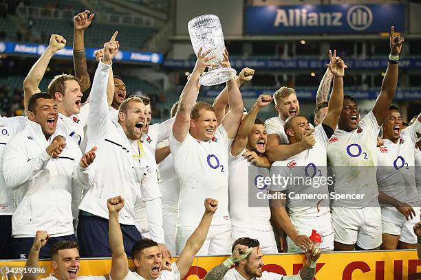 England captain Dylan Hartley poses with the Cook Cup and team mates after winning the International Test match between the Australian Wallabies and...