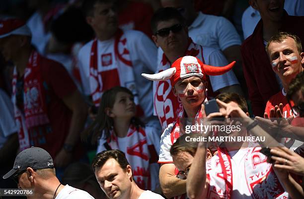 Poland supporters look on during the Euro 2016 round of sixteen football match Switzerland vs Poland, on June 25, 2016 at the Geoffroy Guichard...