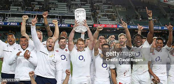 Dylan Hartley, the England captain, raies the Cook Cup after their series victory during the International Test match between the Australian...