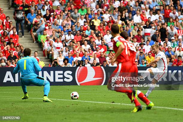 Jakub Blaszczykowski of Poland scores the opening goal past Yann Sommer of Switzerland during the UEFA EURO 2016 round of 16 match between...