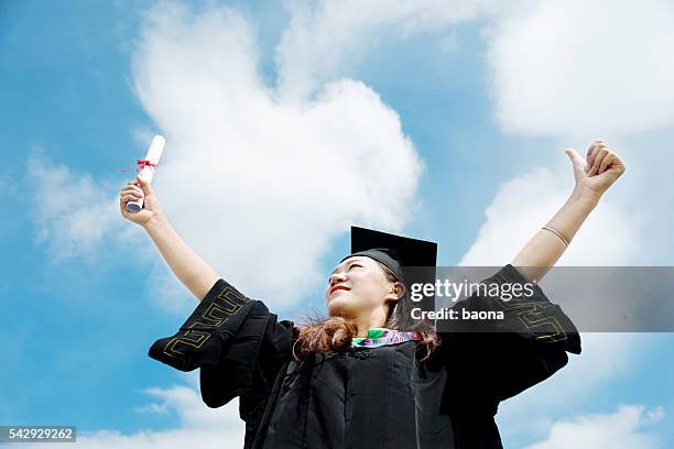 Happy Female Graduate High-Res Stock Photo