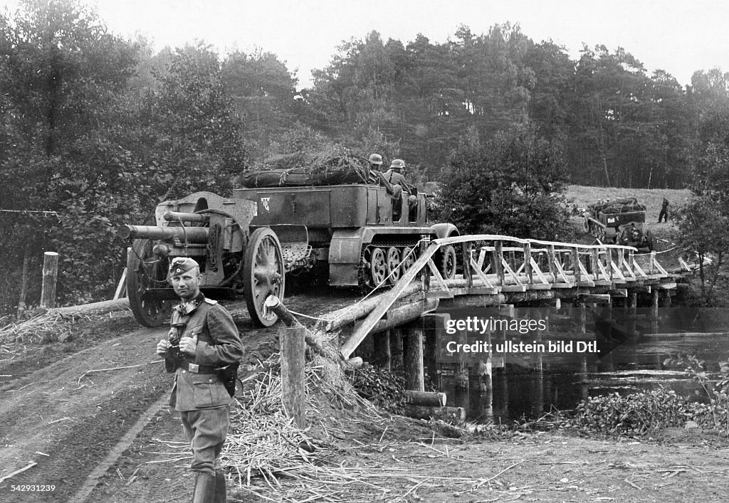 2. WW, campaign in Poland (Invasion) 01.-28.09.1939 : motorized field artillerie (half-track) crossing the river Brahe (Brda /west-prussia) on a emergency bridge build by german engineer troops. september 1939