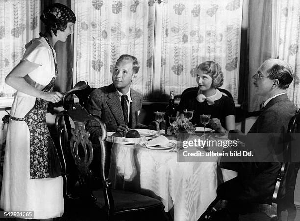 Series: 'Carp roulade': woman telling their dinner guests about the catastrophy in the kitchen- Photographer: Yva- Published in Uhu 12/1932Vintage...