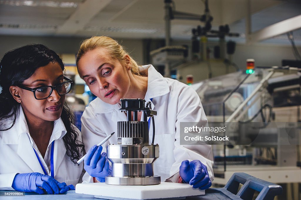 Medical Engineers Examining Equipment