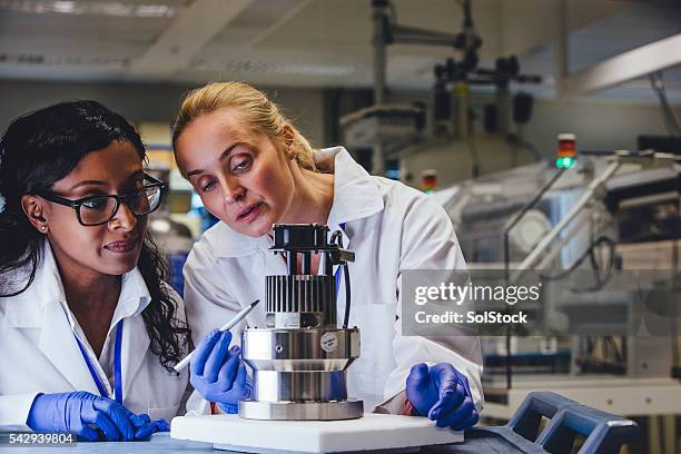 medical engineers examining equipment - drug discovery stock pictures, royalty-free photos & images