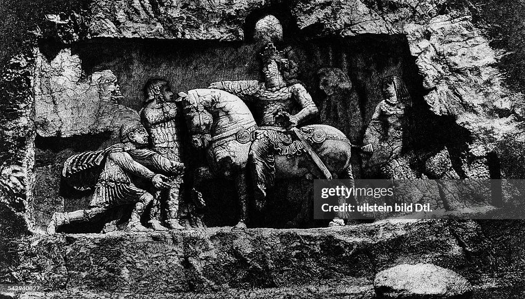 Late Antiquity Sassanid Empire Rock relief of Naqsh-e Rustam near Persepolis showing the triumphant victory of Sassanid Emperor Sapor (ruling from c. 240 or 242 - 272 A.D.) over the Roman Emperor Valerian after the Battle of Edessa / Karrhai (260) -