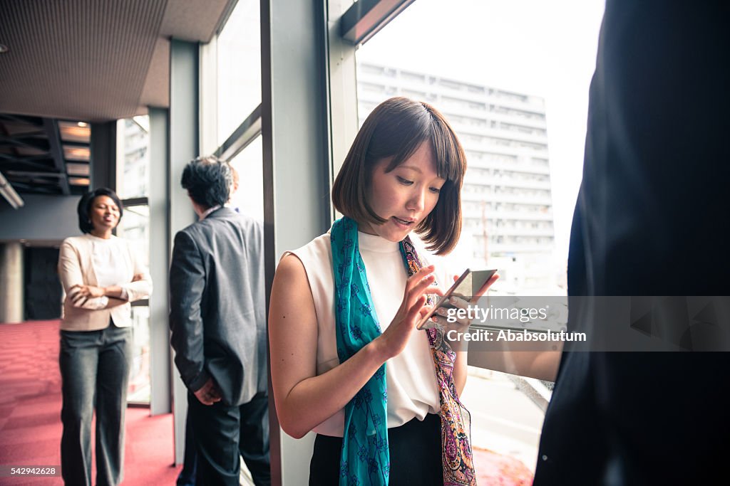 Beautiful Young Japanese Businesswoman with Smart Phone, Kyoto, Japan