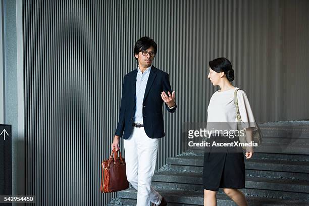 walking business meeting - minimalist living in japan stock pictures, royalty-free photos & images