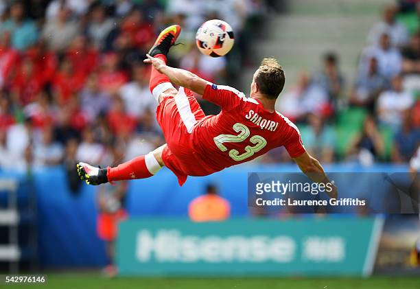 Xherdan Shaqiri of Switzerland scores his team's first goal during the UEFA EURO 2016 round of 16 match between Switzerland and Poland at Stade...