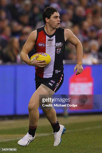 Paddy McCartin of the Saints looks upfield during the round 14 AFL match between the St Kilda Saints and the Geelong Cats at Etihad Stadium on June...