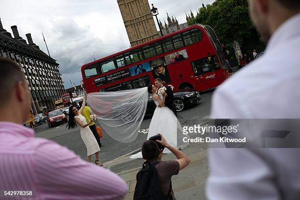 Ukrainian nationals Vitaliy and Olena who currently live and work in East London have wedding photographs taken outside the Houses of Parliament the...