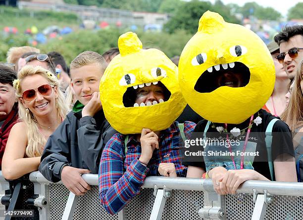 Festival goers dressed as Earl of Lemongrab of Adventure Time enjoy Glastonbury Festival 2016 at Worthy Farm, Pilton on June 25, 2016 in Glastonbury,...