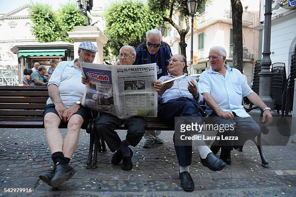 People in a town in southern Italy read in a square a newspaper declaring about Brexit and UK leaving the European Union on June 25, 2016 in the town...