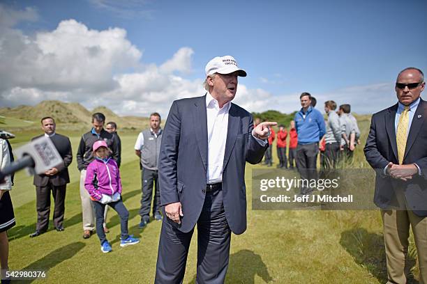 Presumptive Republican nominee for US president Donald Trump arrives at Trump International Golf Links on June 25, 2016 in Aberdeen, Scotland. The US...