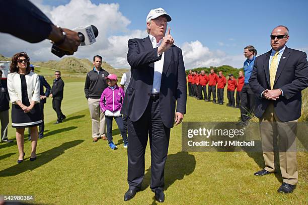 Presumptive Republican nominee for US president Donald Trump arrives at Trump International Golf Links on June 25, 2016 in Aberdeen, Scotland. The US...